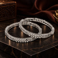Rhodium Plated Designer Bangle Set with Intricate Linear Pattern & Crystal Detailing – Pack of 2