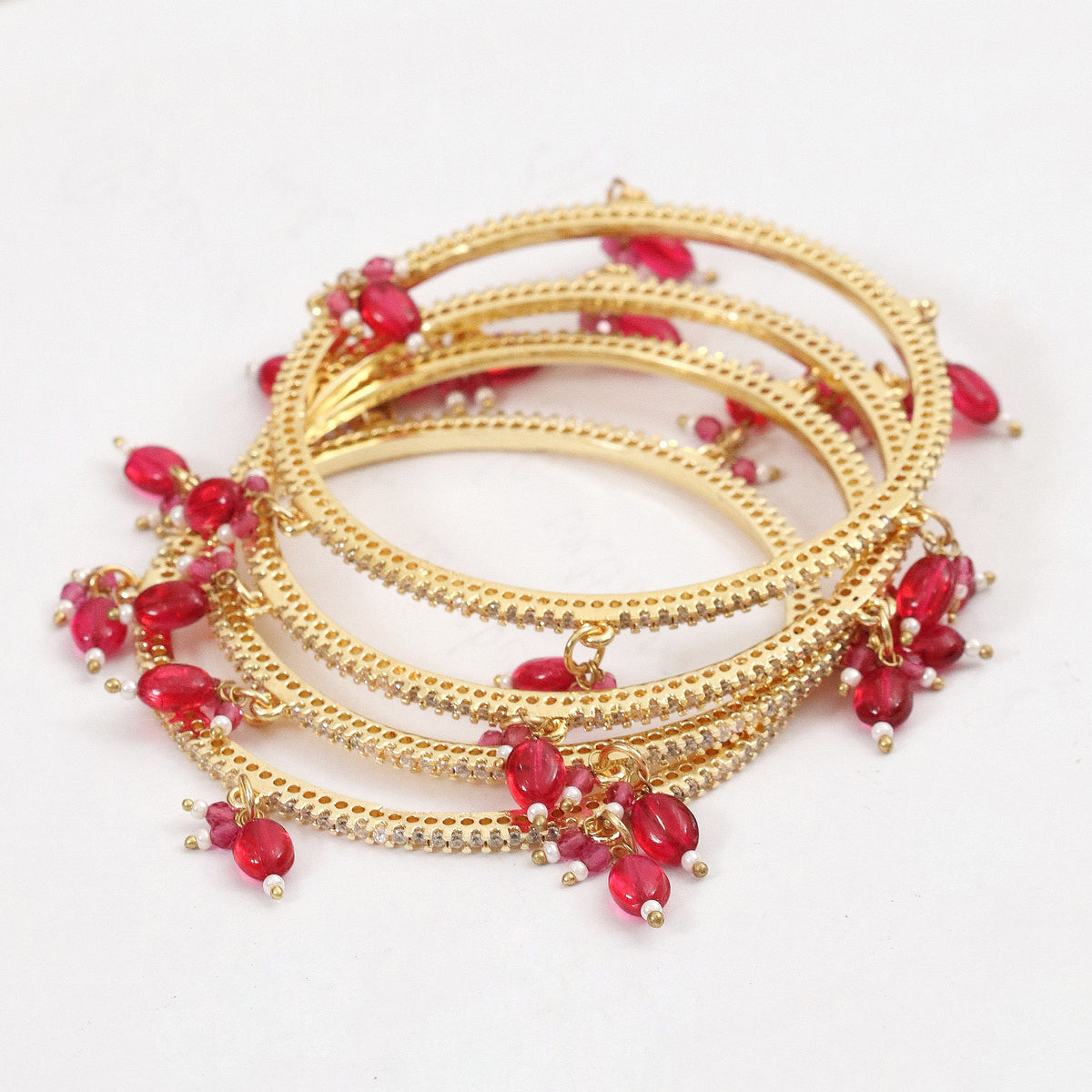 Gold Plated American Diamond Beaded Charm Pattern Designer Bangles Set (Pack of 4)