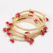 Gold Plated American Diamond Beaded Charm Pattern Designer Bangles Set (Pack of 4)