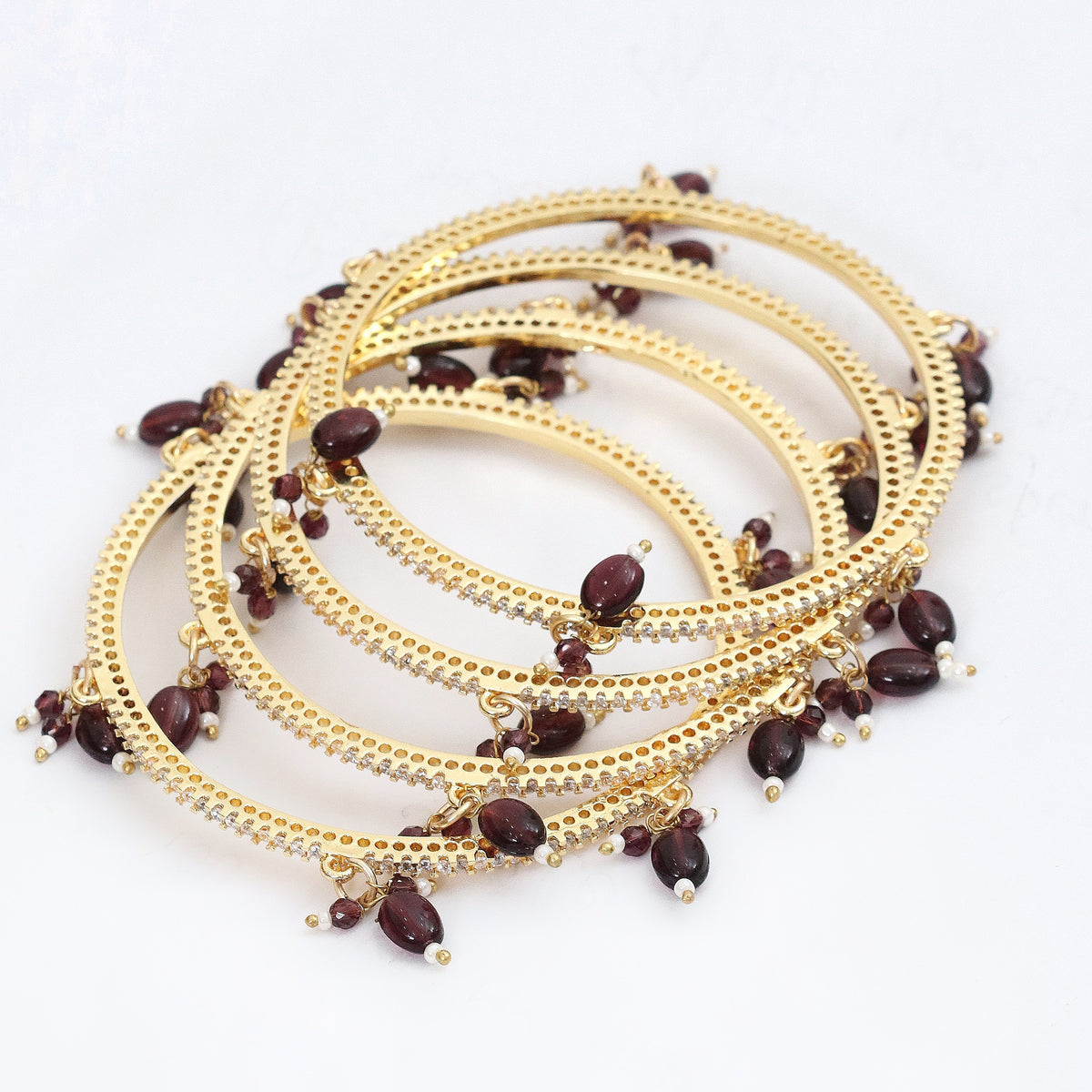 Gold Plated American Diamond Beaded Charm Pattern Designer Bangles Set (Pack of 4)