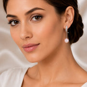 Rhodium Plated Curved Wave Pearl Drop Earrings