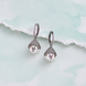 Black Plated Pearl Drop Earrings with Intricate Filigree Dome and Stone-Studded Hoop Design