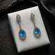 Rhodium Plated American Diamond Teardrop Dangle Earrings with Pear Cut Stone