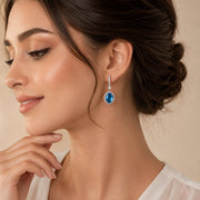 Rhodium Plated Oval Halo Drop Earrings with Sparkling Stone Accent