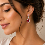 Rhodium Plated Oval Halo Drop Earrings with Sparkling Stone Accent