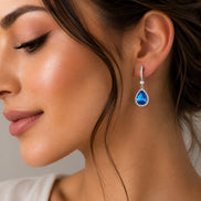 Rhodium Plated Pear Halo Drop Earrings with Sparkling Stone Accent