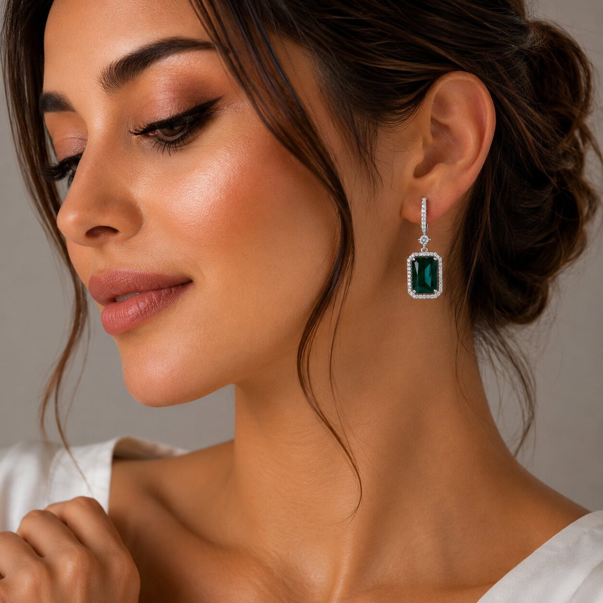 Rhodium Plated Emerald Cut Halo Drop Earrings with Sparkling Stone Accent