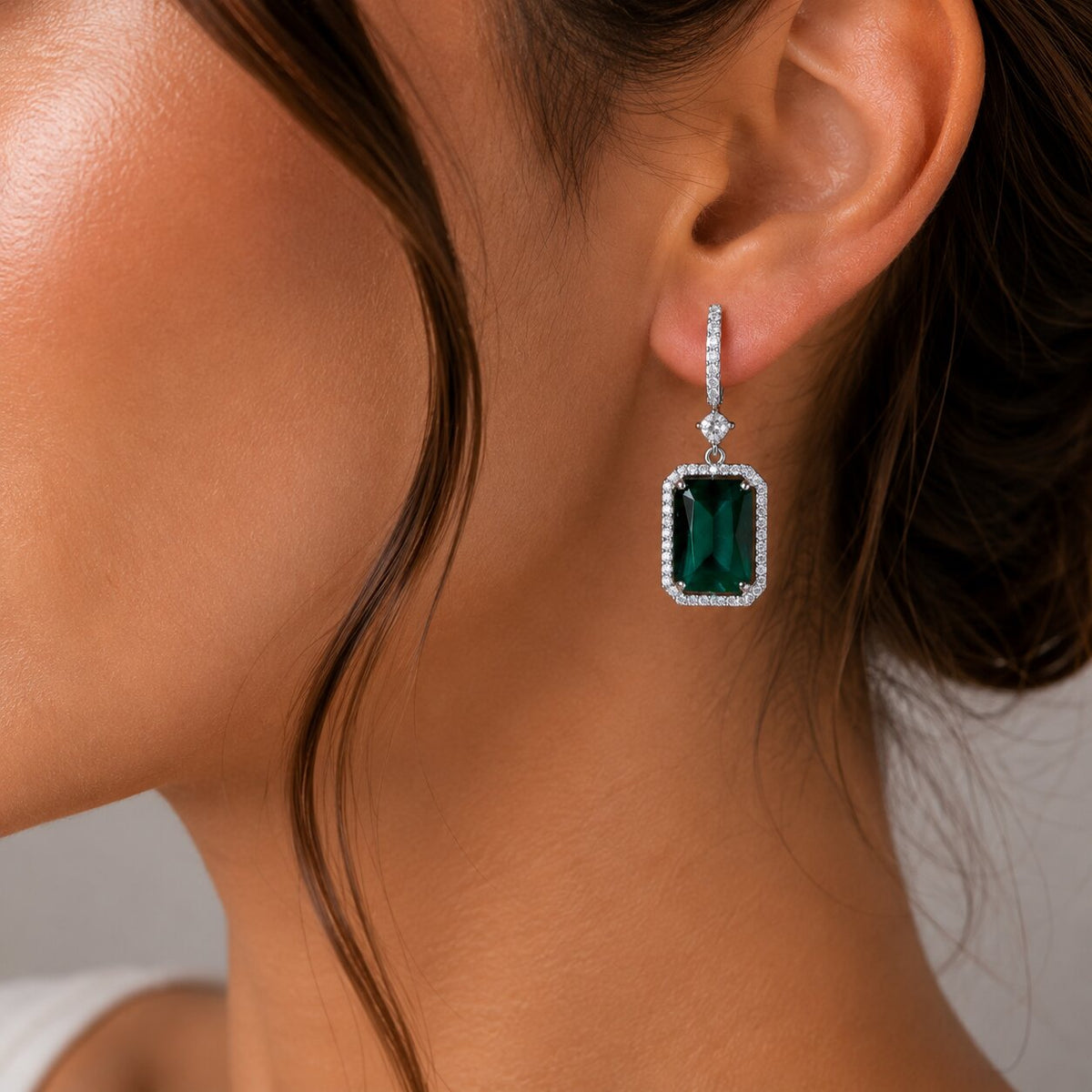 Rhodium Plated Emerald Cut Halo Drop Earrings with Sparkling Stone Accent
