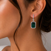 Rhodium Plated Emerald Cut Halo Drop Earrings with Sparkling Stone Accent
