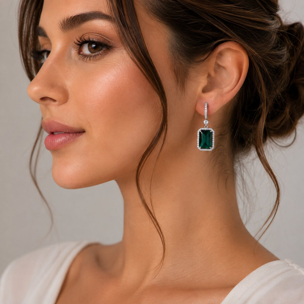 Rhodium Plated Emerald Cut Halo Drop Earrings with Sparkling Stone Accent