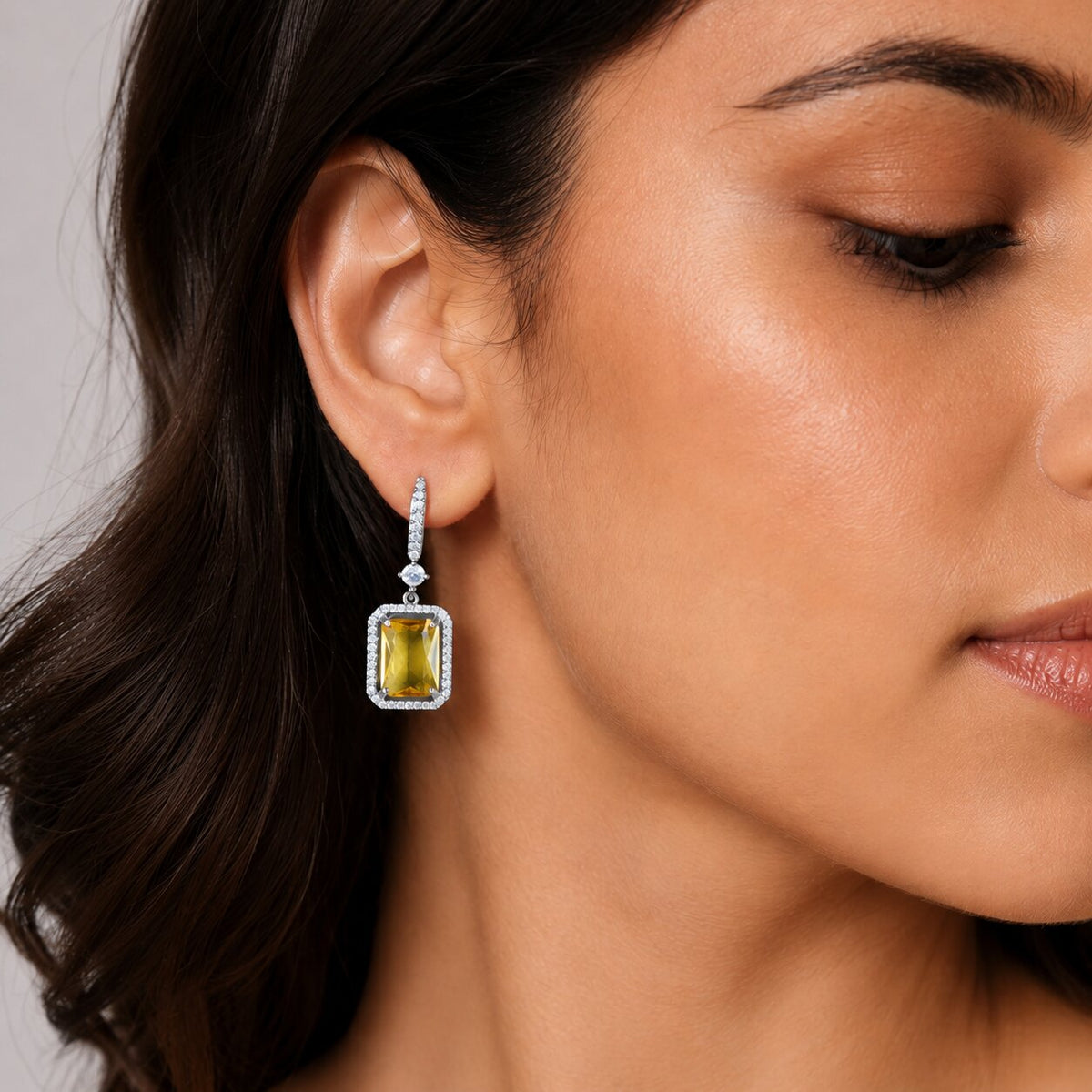 Rhodium Plated Emerald Cut Halo Drop Earrings with Sparkling Stone Accent