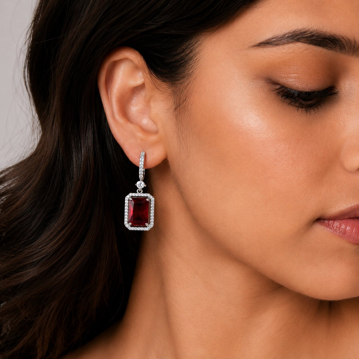 Rhodium Plated Emerald Cut Halo Drop Earrings with Sparkling Stone Accent
