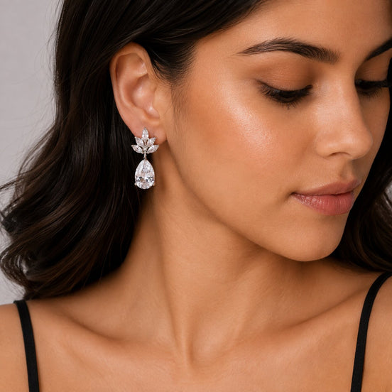 Rhodium Plated Pear Drop Earrings with Floral Stone Design
