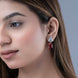 Rhodium Plated Pear Drop Earrings with Floral Stone Design
