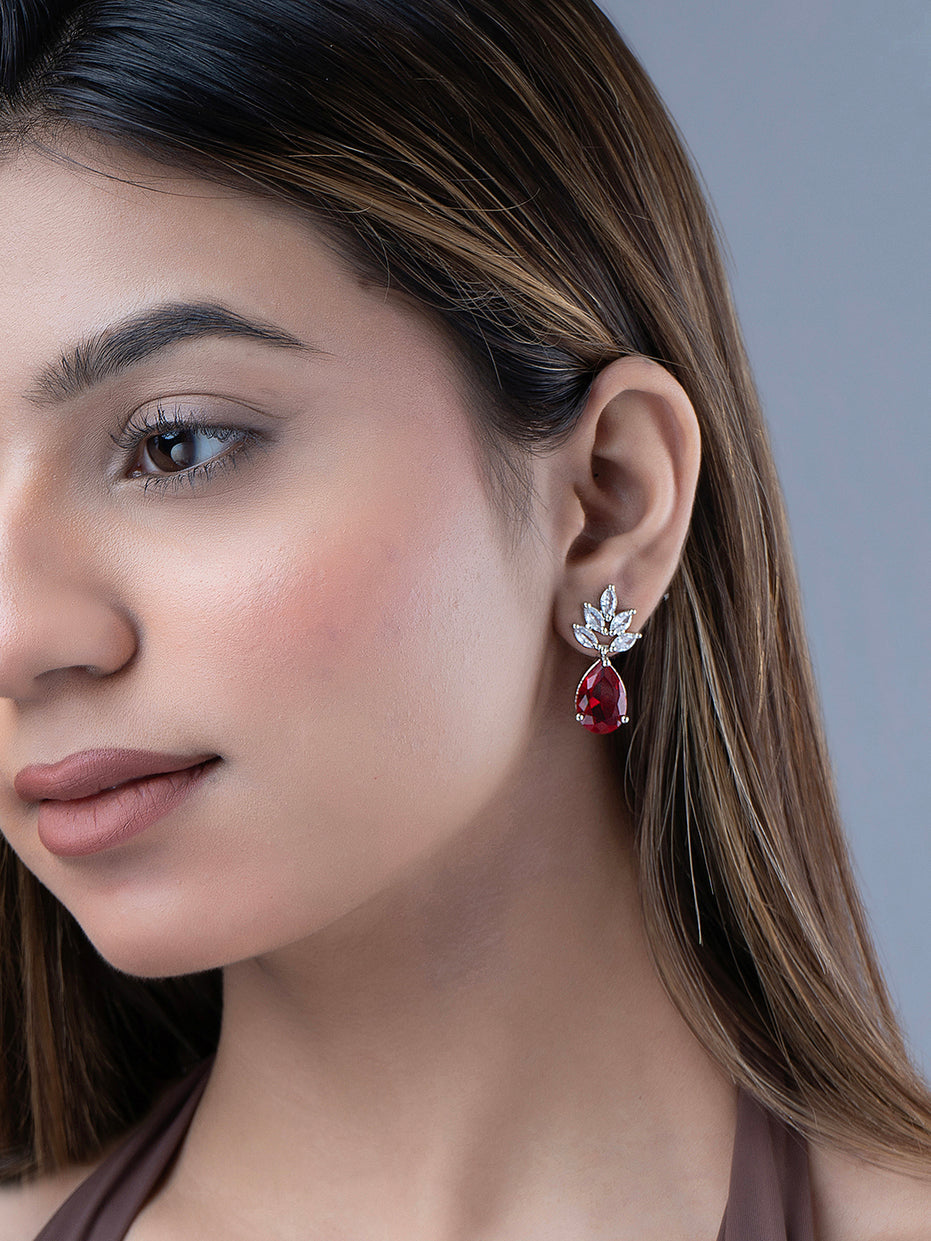 Rhodium Plated Pear Drop Earrings with Floral Stone Design