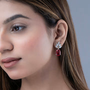 Rhodium Plated Pear Drop Earrings with Floral Stone Design