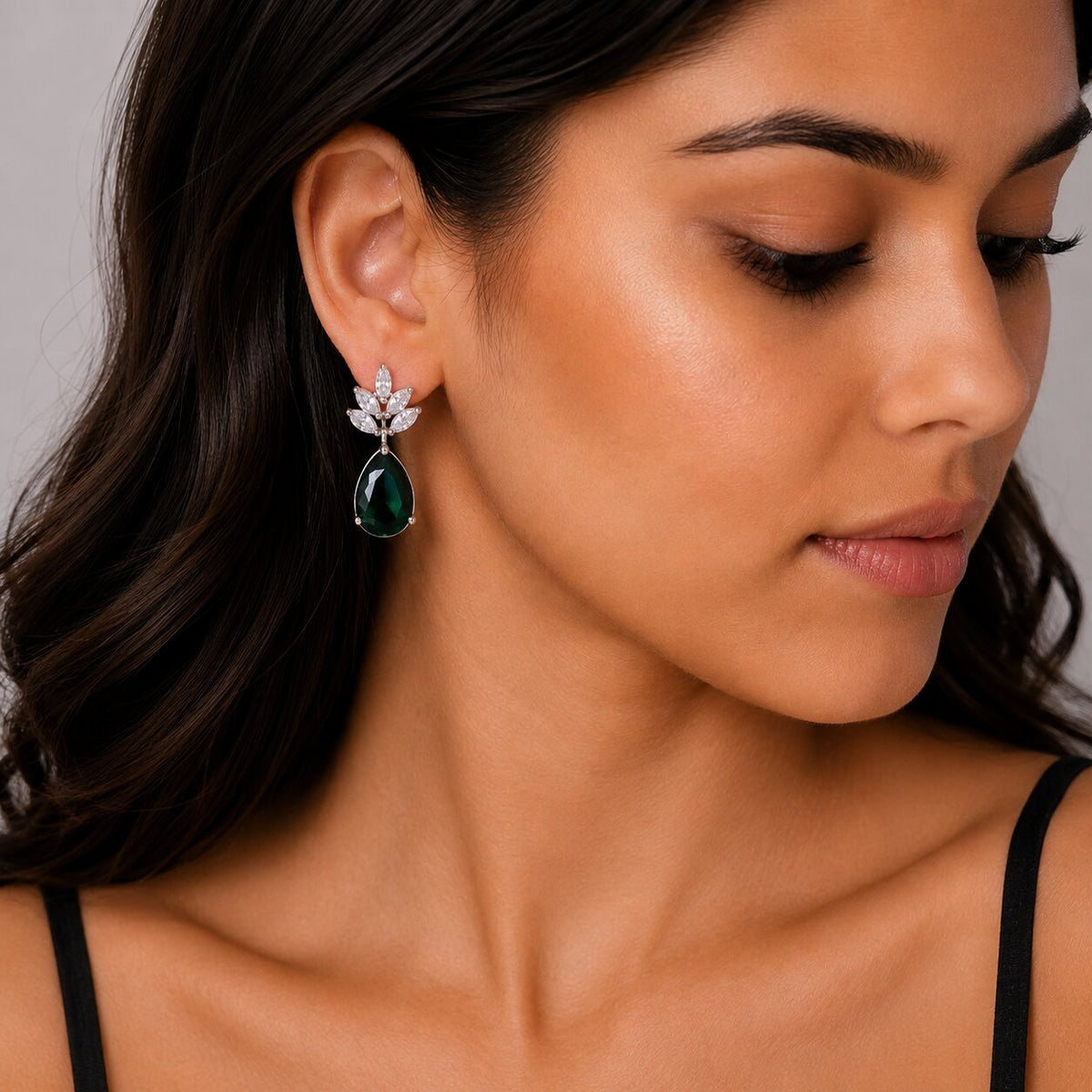 Rhodium Plated Pear Drop Earrings with Floral Stone Design