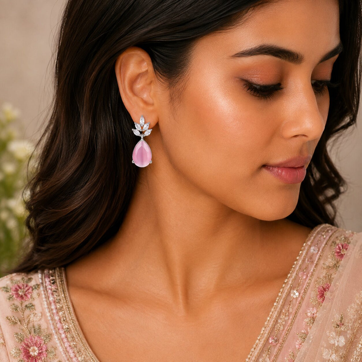 Rhodium Plated Pear Drop Earrings with Floral Stone Design