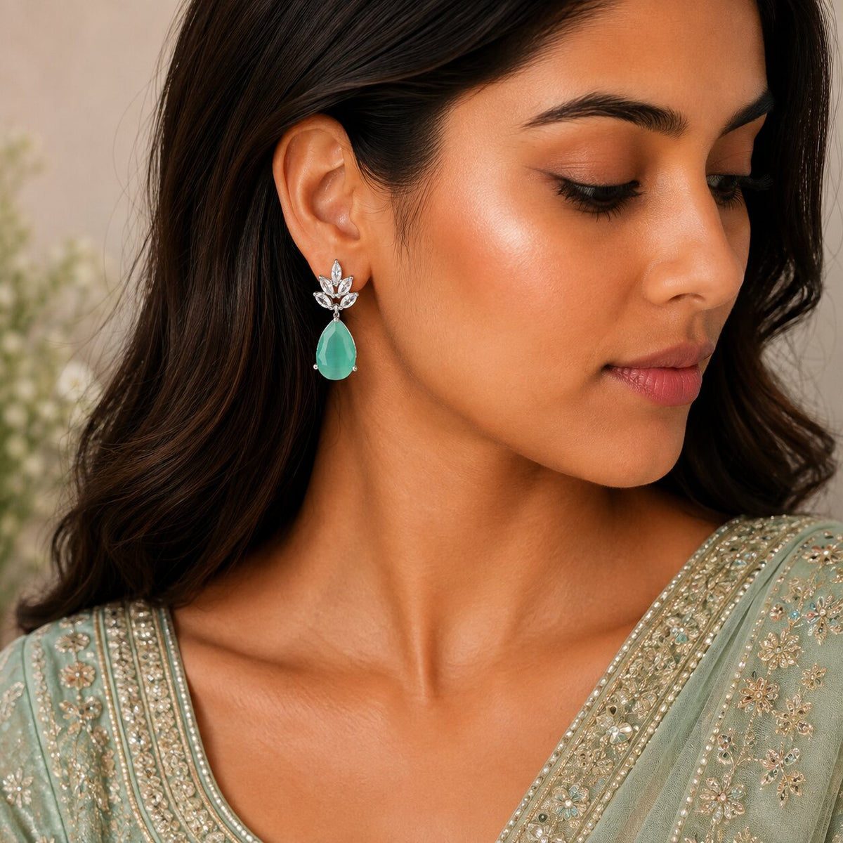 Rhodium Plated Pear Drop Earrings with Floral Stone Design