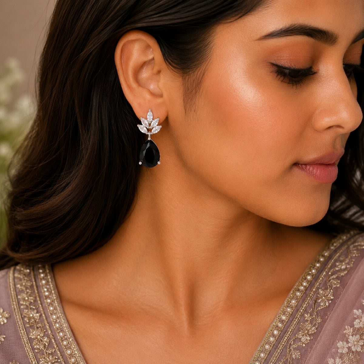 Rhodium Plated Pear Drop Earrings with Floral Stone Design