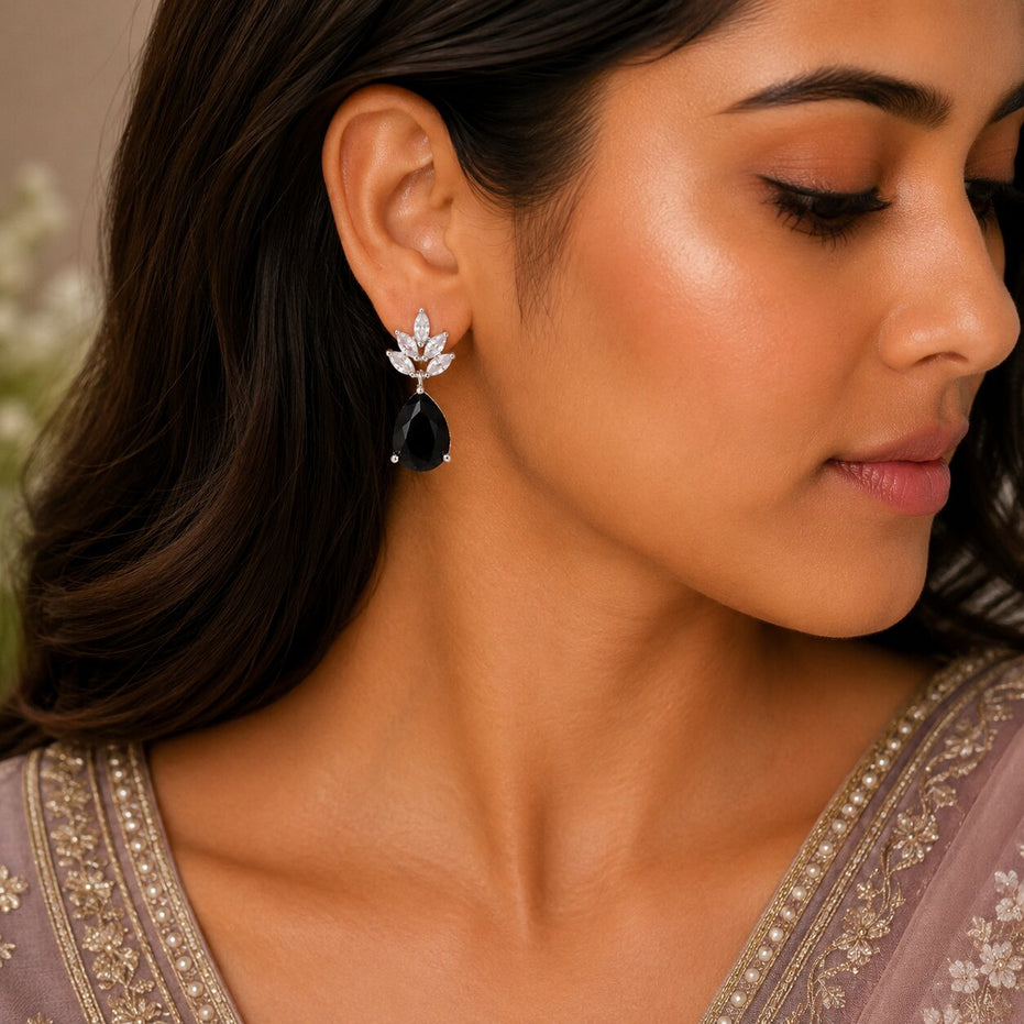 Rhodium Plated Pear Drop Earrings with Floral Stone Design