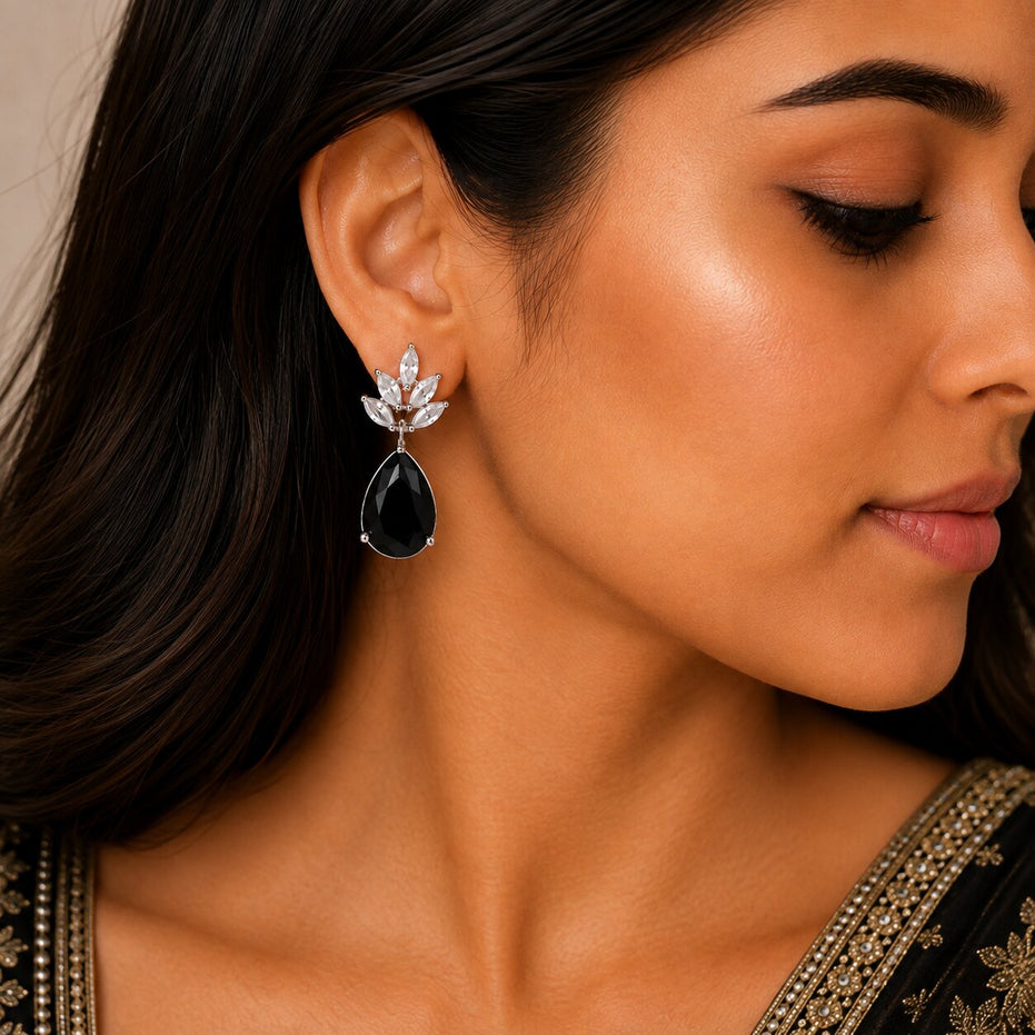 Rhodium Plated Pear Drop Earrings with Floral Stone Design