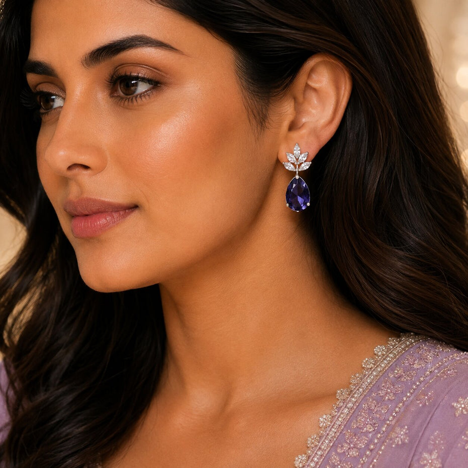Rhodium Plated Pear Drop Earrings with Floral Stone Design