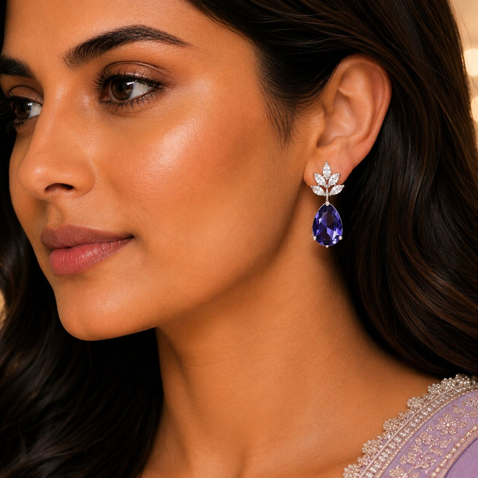 Rhodium Plated Pear Drop Earrings with Floral Stone Design