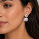 Rhodium Plated Square Halo Drop Earrings with Floral Stone Design