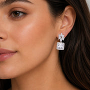 Rhodium Plated Square Halo Drop Earrings with Floral Stone Design
