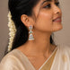 Rhodium Plated Floral Motif & Pearl Drops Designer Jhumka Pattern Earrings