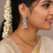 Rhodium Plated Floral Motif & Pearl Drops Designer Jhumka Pattern Earrings