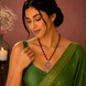 Ethnic Gemstone Mehendi Plated Locket Set with Sparkling Floral Pendant