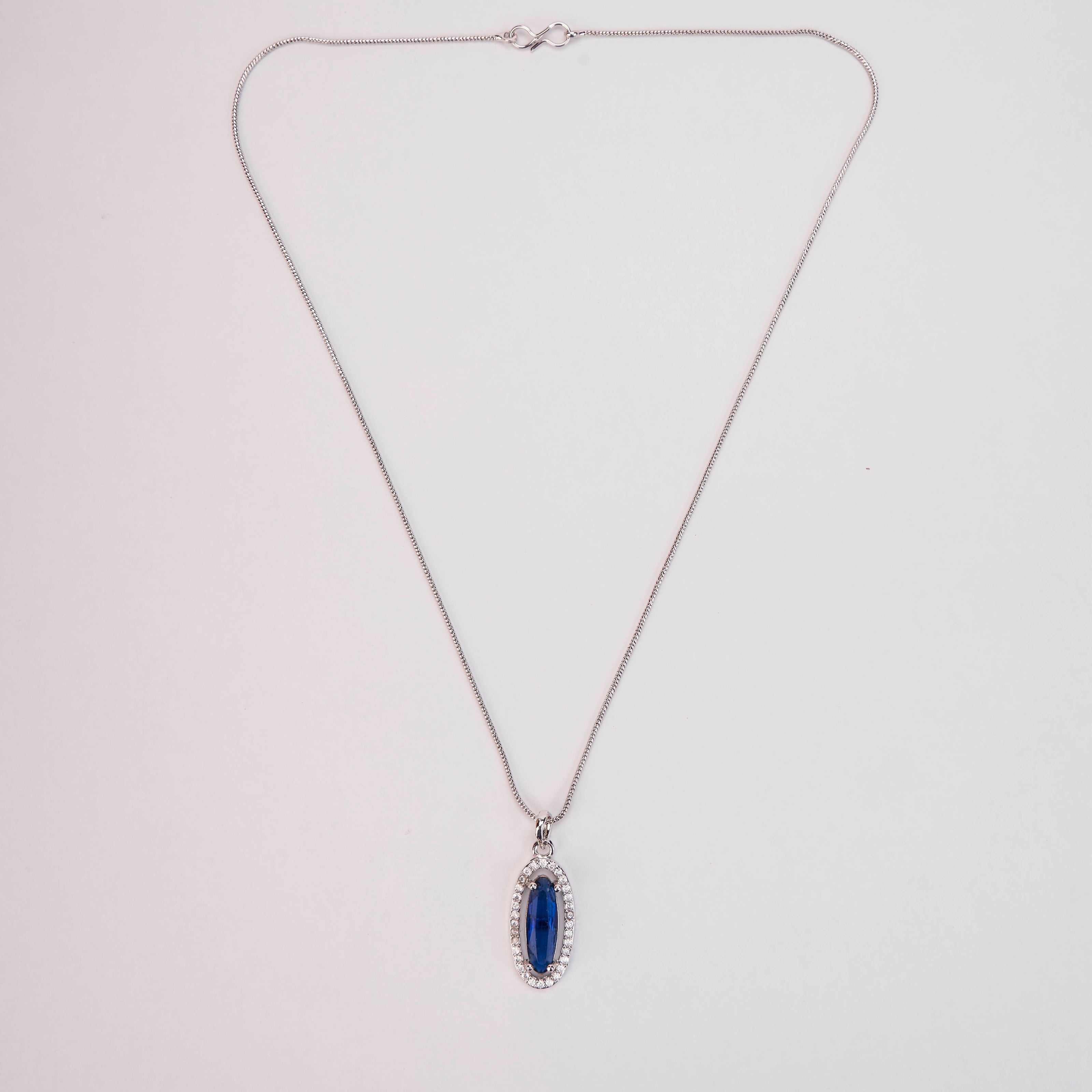 Elongated Oval Halo Design Rhodium Plated Pendant with chain-Crystal Blue