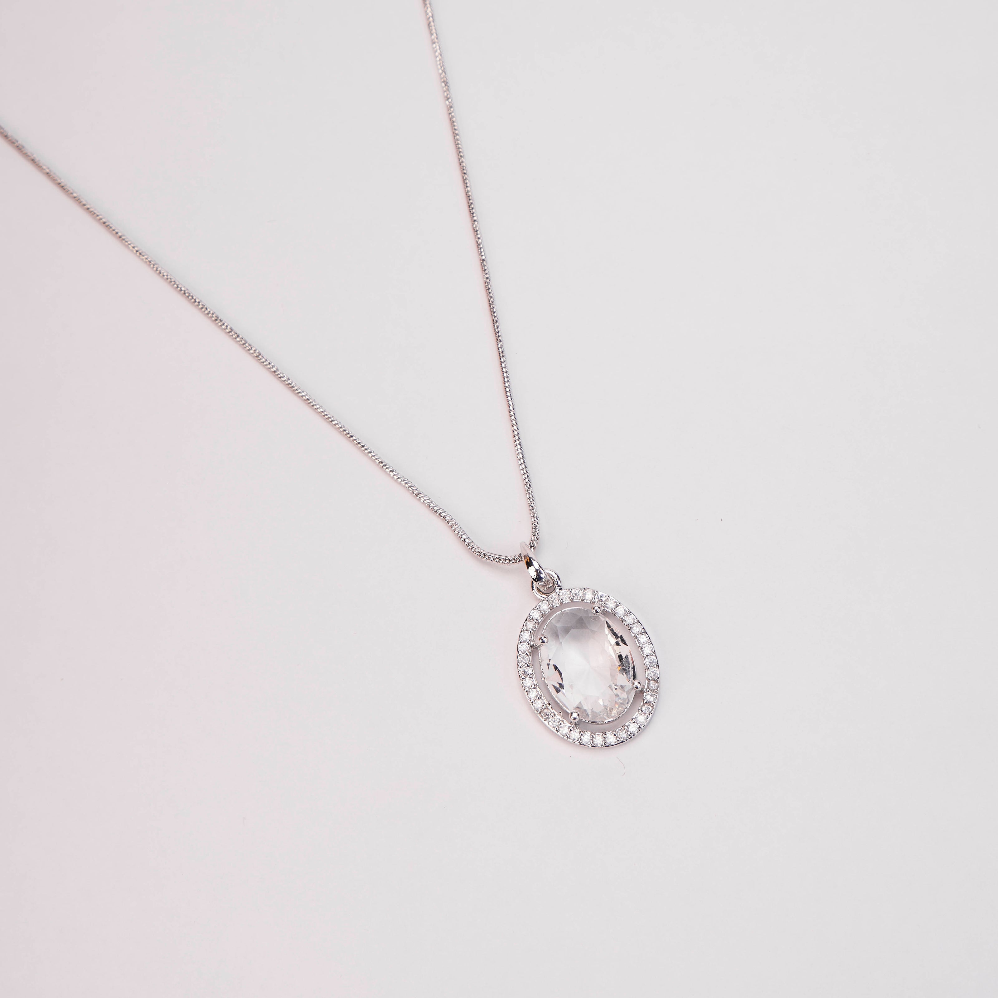 Rhodium Plated Round Pendant Necklace with Faceted Statement Stone