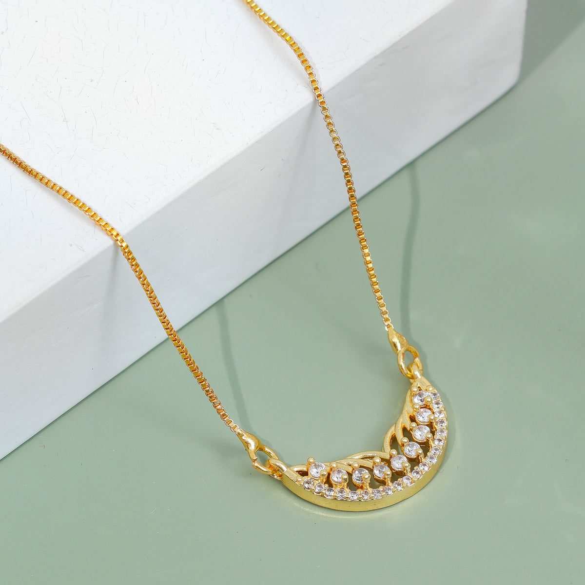Stylish Half-Moon CZ Pendant Necklace with Sparkling Stone Accents