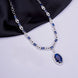 Rhodium Plated AD Necklace Set with Oval Halo Pendant and Matching Earrings