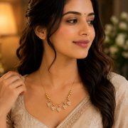 Gold Plated American Diamond Heart Charm Necklace with Stone Studded Dangle Charms
