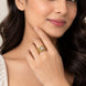 Gold Plated Round Centre Stone & Baguette Stone Work with Criss Cross Band Patter Designer Statement Ring